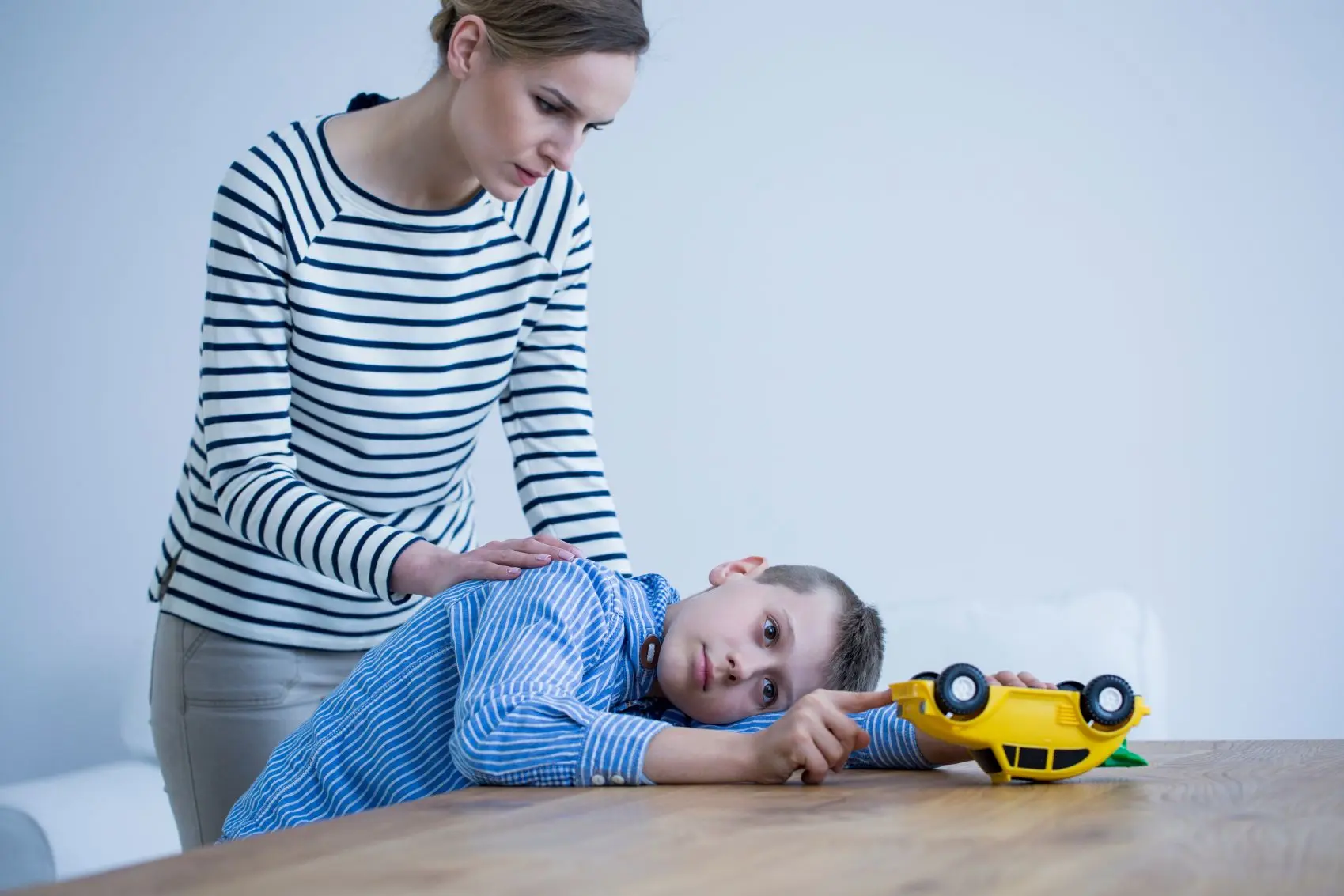 A child working with a therapist during an ABA session